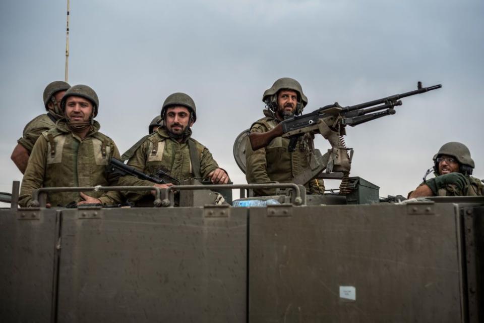 Israeli soldiers keep watch along the Gaza border.