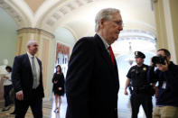 FILE PHOTO: U.S. Senate Majority Leader Mitch McConnell (R-KY) walks to the Senate floor to speak and vote after meeting with U.S. President Donald Trump at the White House, as deadlines for a federal government shutdown loom in Washington, U.S. December 21, 2018. REUTERS/Jonathan Ernst/File Photo