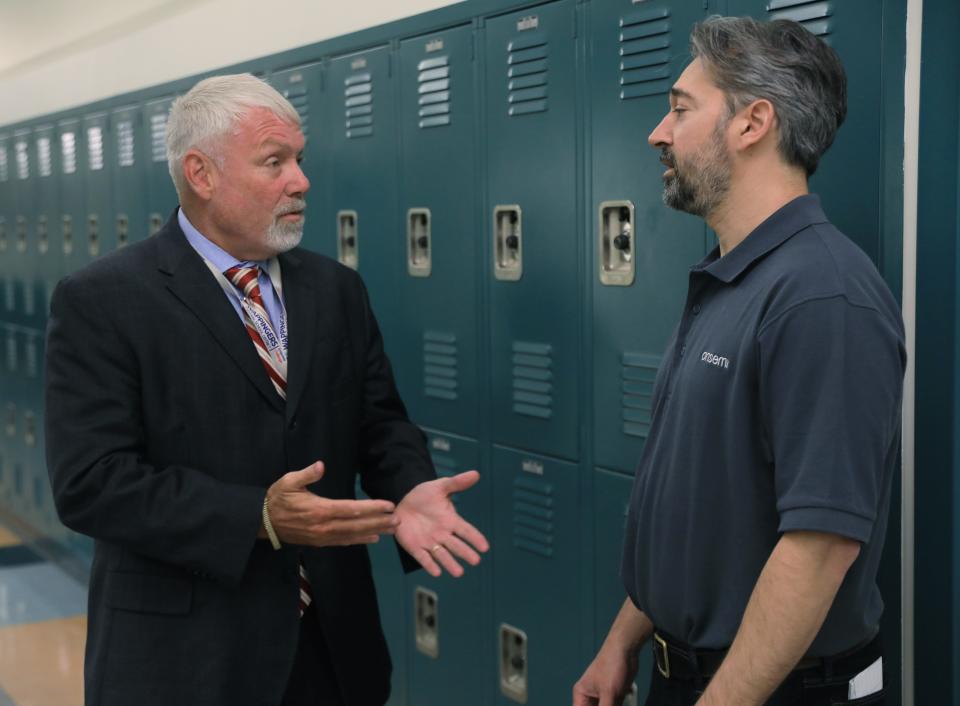 From left, Wappingers Central School District superintendent Dwight Bonk talks with Onsemi East Fishkill Fab engineering director, Steffen Kaldor while students form John Jay High School tour the Onsemi microchip fab in East Fishkill on May 25, 2023. 
