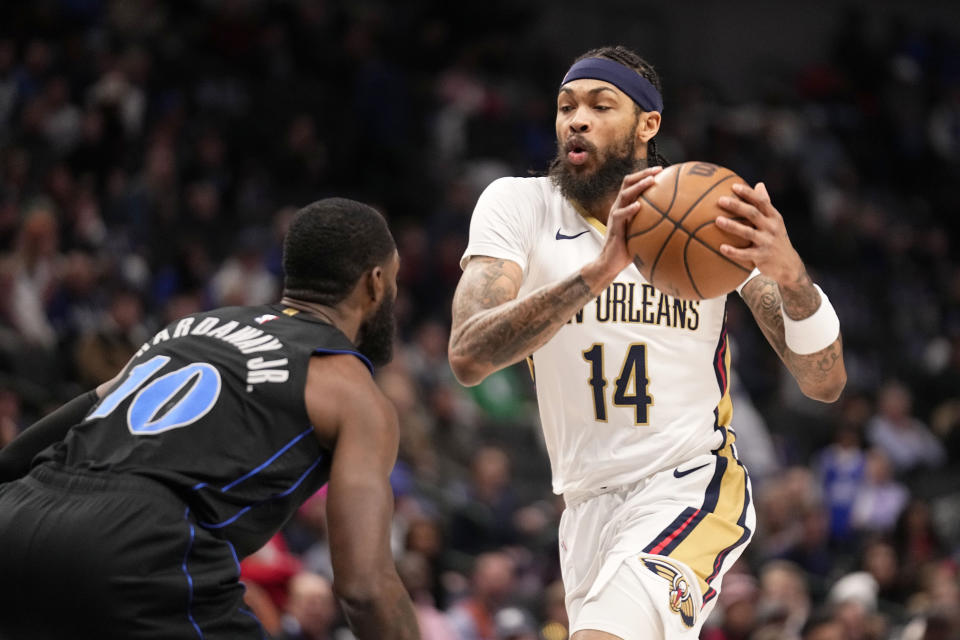 New Orleans Pelicans forward Brandon Ingram (14) works against Dallas Mavericks forward Tim Hardaway Jr. (10) in the first half of an NBA basketball game in Dallas, Monday, Jan. 15, 2024. (AP Photo/Tony Gutierrez)