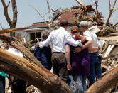 <p>President Barack Obama, second from left, with residents views damage from the tornado that devastated Joplin, Mo., Sunday, May 29, 2011. (AP Photo/J. Scott Applewhite) </p>