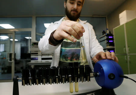 Technician Ilya Podolsky works at the Russian anti-doping laboratory in Moscow, Russia, May 24, 2016. REUTERS/Sergei Karpukhin