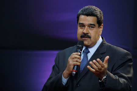 Venezuela's President Nicolas Maduro gestures as he speaks during the event launching the new Venezuelan cryptocurrency "petro" in Caracas, Venezuela February 20, 2018. REUTERS/Marco Bello/Files