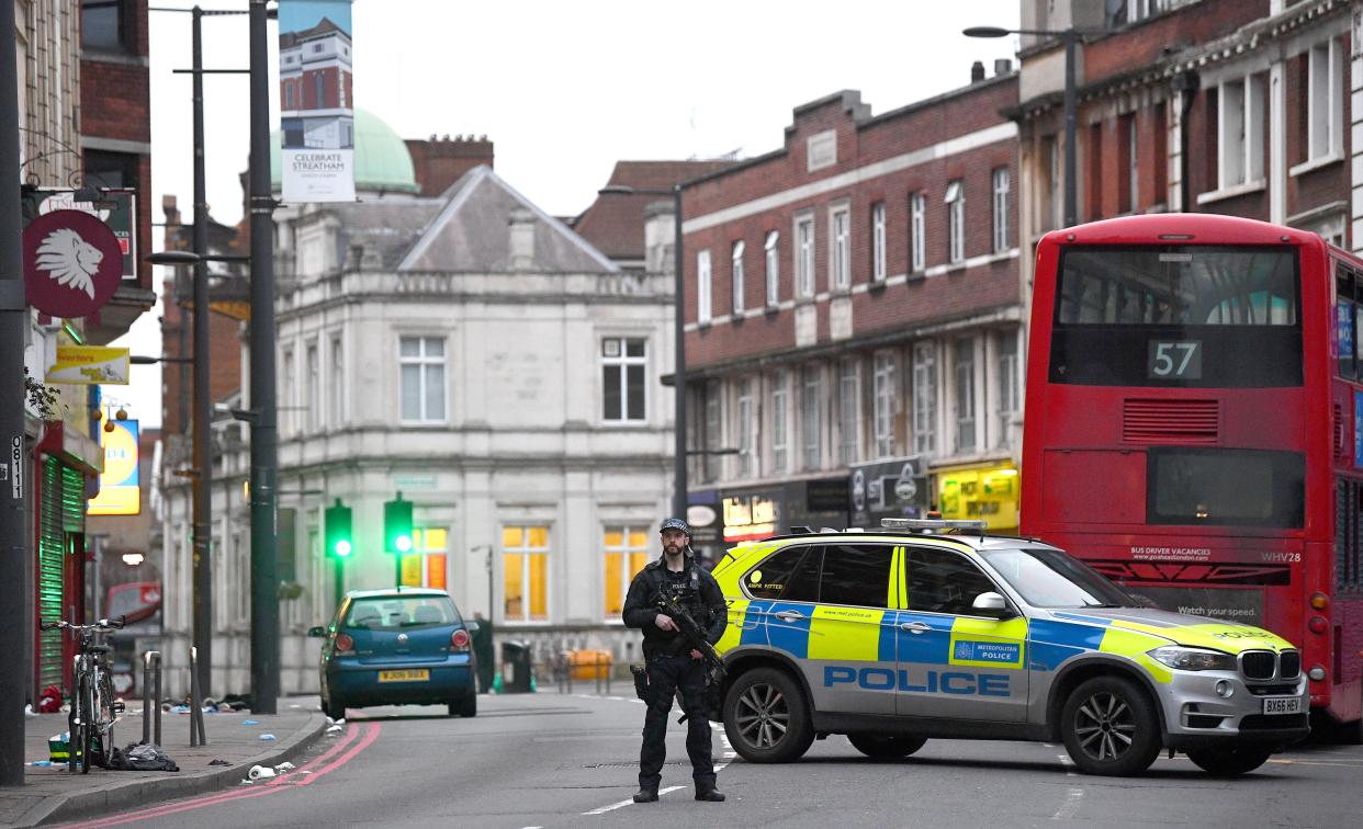 Armed police at the scene in Streatham High Road, south London, after a man was shot dead by armed officers (Victoria Jones/PA) (PA Archive)