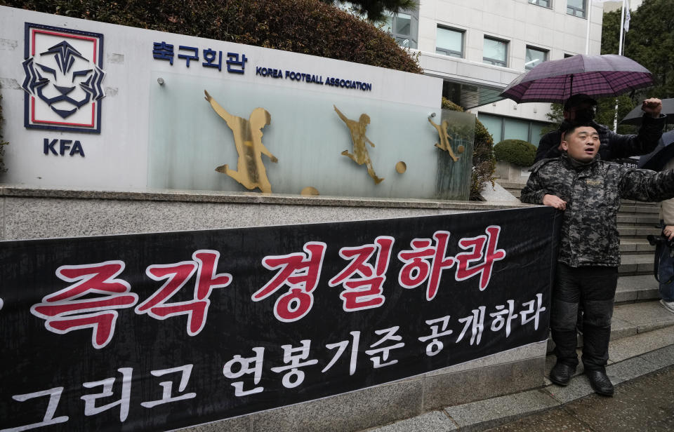 Soccer fans display a banner demanding the dismissal of the South Korean men's football head coach Jurgen Klinsmann in front of the headquarters of the Korean Football Association (KFA) in Seoul, South Korea, Thursday, Feb. 15, 2024. KFA officials have recommended Klinsmann be fired after an Asian Cup semifinal exit and reports of infighting among star players. The banner reads "Fire Klinsmann Immediately." (AP Photo/Ahn Young-joon)