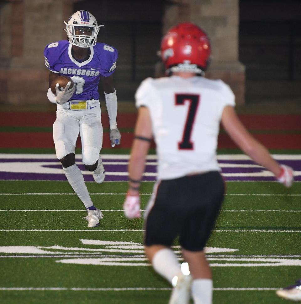 Jacksboro sophomore Kaleem Howard (8) returns the opening kickoff Friday night against Eastland. Howard later scored a second quarter touchdown for the Tigers.
