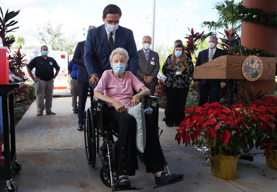 Florida Gov. Ron DeSantis' photo op with an 88-year-old who received a COVID-19 vaccine at the John Knox Village Continuing Care Retirement Community on Dec. 16, 2020, in Pompano Beach, Florida.  (Photo: Joe Raedle via Getty Images)