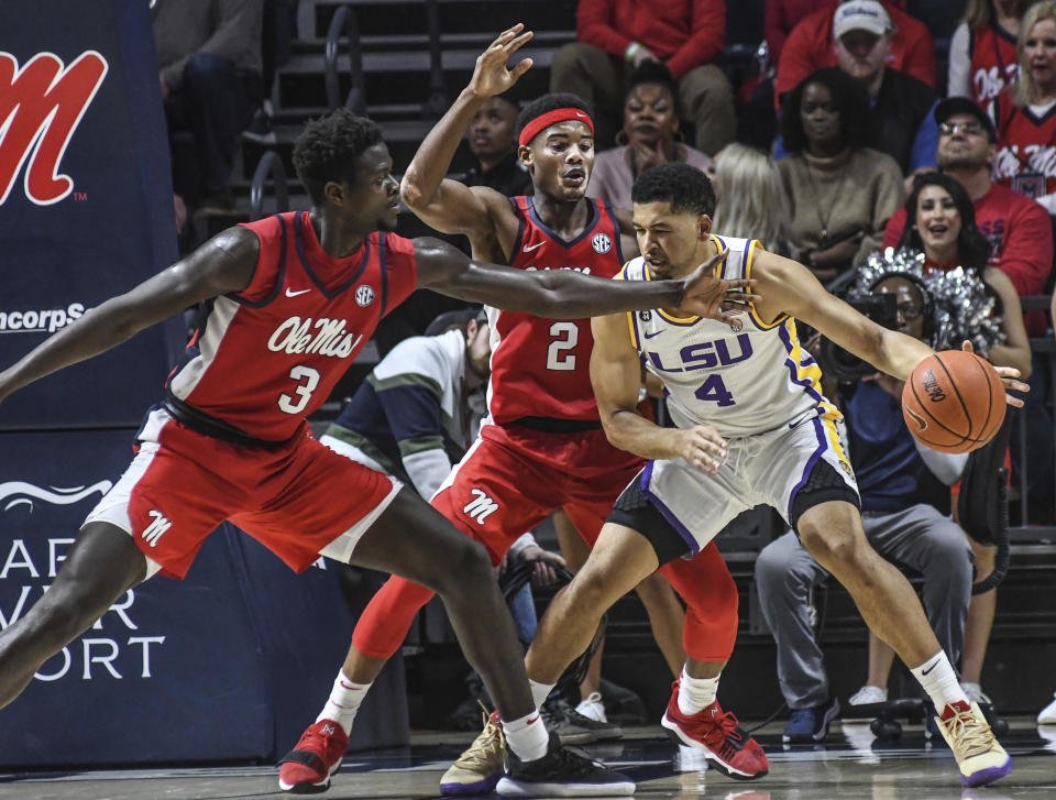 LSU guard Skylar Mays (4) is defended by Mississippi forward Khadim Sy (3) and guard Devontae Shuler (2) during an NCAA college basketball game in Oxford, Miss., Saturday, Jan. 18, 2020. (Bruce Newman/The Oxford Eagle via AP)