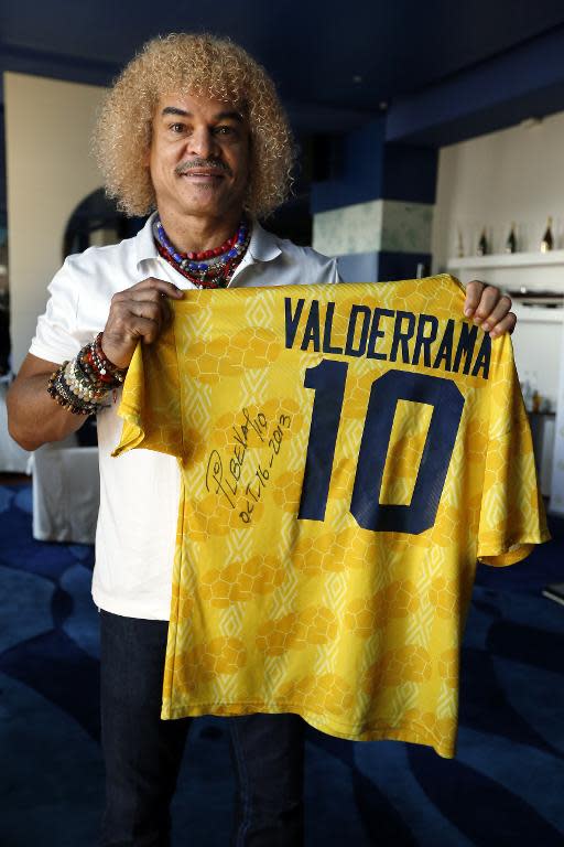 Carlos Valderrama poses with a jersey on October 16, 2013 in Monaco during the 2013 Golden Foot Awards