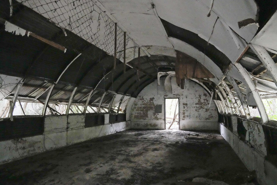 This photo shows abandoned concrete structures called "Quonset huts" formerly used as barracks for U.S. Marines in what used to be America's largest overseas naval base at the Subic Bay Freeport Zone, Zambales province, northwest of Manila, Philippines on Monday Feb. 6, 2023. The U.S. has been rebuilding its military might in the Philippines after more than 30 years and reinforcing an arc of military alliances in Asia in a starkly different post-Cold War era when the perceived new regional threat is an increasingly belligerent China. (AP Photo/Aaron Favila)