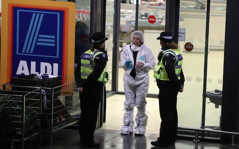 Forensic officers at the scene of a fatal stabbing in Aldi supermarket, Skipton - Credit: Ben Lack