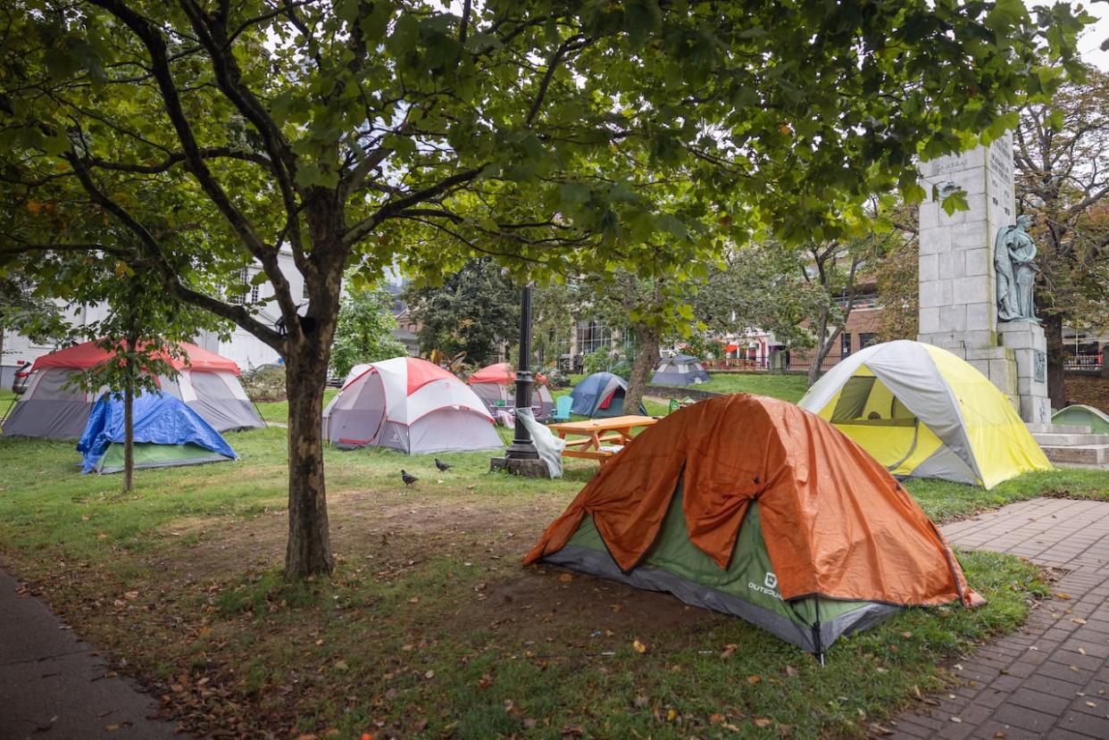A tent encampment at Victoria Park and Grand Parade in central Halifax in 2023. Officials with the Halifax Regional Municipality expect more tents will pop up in the city this summer. (Robert Short/CBC - image credit)