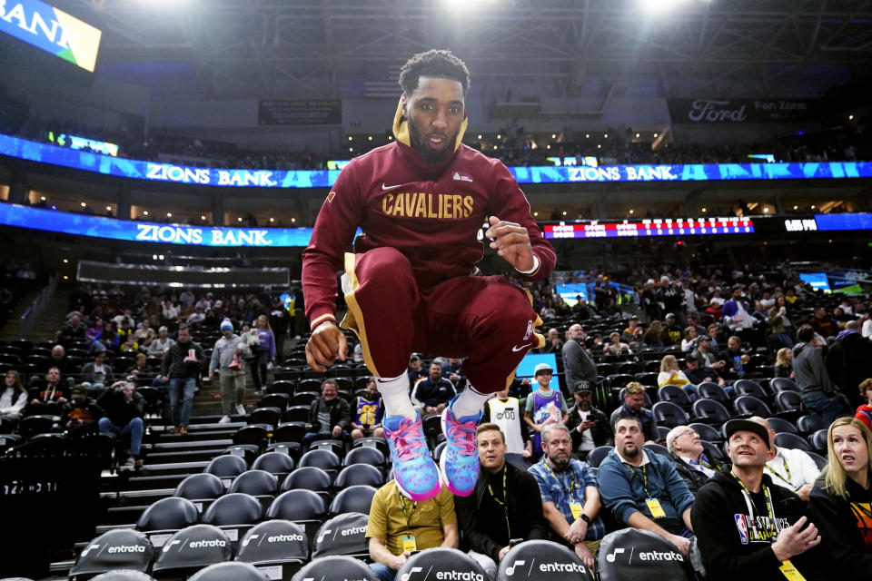 Cleveland Cavaliers guard Donovan Mitchell leaps before the team's NBA basketball game against the Utah Jazz on Tuesday, Jan. 10, 2023, in Salt Lake City. (AP Photo/Rick Bowmer)