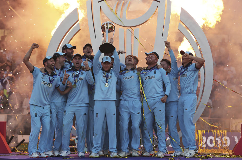 England's captain Eoin Morgan lifts the trophy after winning the Cricket World Cup final match between England and New Zealand at Lord's cricket ground in London, England, Sunday, July 14, 2019. England won the Cricket World Cup for the first time in extraordinary circumstances, beating New Zealand by a tiebreaker of boundaries scored after the match was tied after regulation play and then the first Super Over in the tournament's history. (AP Photo/Aijaz Rahi)