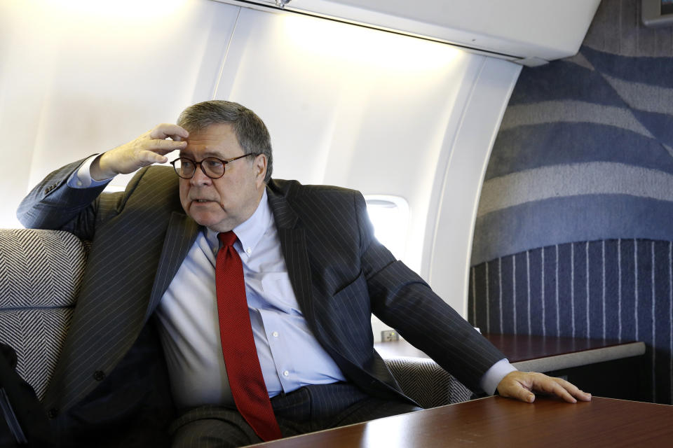Attorney General William Barr speaks with an Associated Press reporter onboard an aircraft en route to Cleveland, Thursday, Nov. 21, 2019, during a two-day trip to Ohio and Montana. (AP Photo/Patrick Semansky)