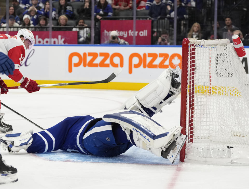 Detroit Red Wings right wing Daniel Sprong scores against Toronto Maple Leafs goalie Ilya Samsonov, right, during third-period NHL hockey game action in Toronto, Sunday, Jan. 14, 2024. (Frank Gunn/The Canadian Press via AP)