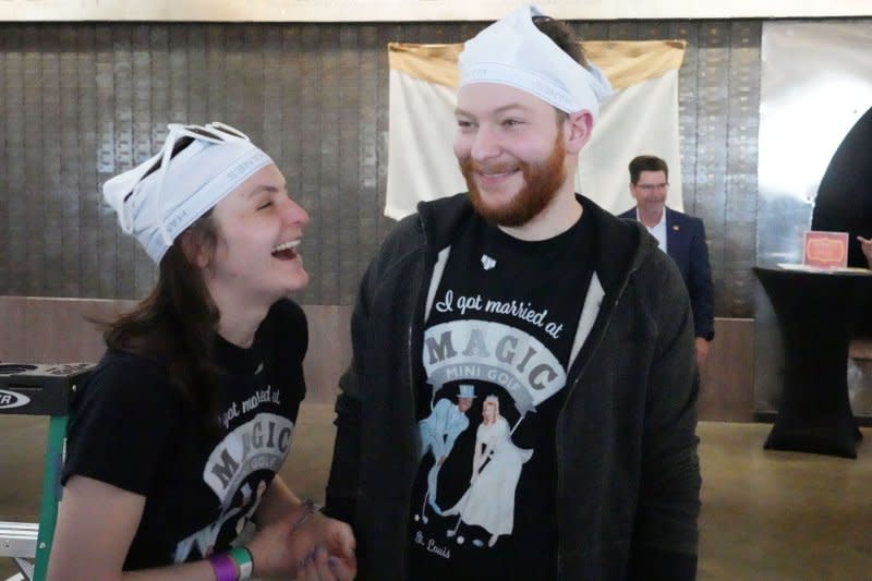 Brandon and Kristen Ebling have a laugh as they wait for the start of the Guinness World Record attempt of the number of people wearing underwear on their heads for at least one minute, at the City Museum, in St. Louis on Thursday. Photo by Bill Greenblatt/UPI