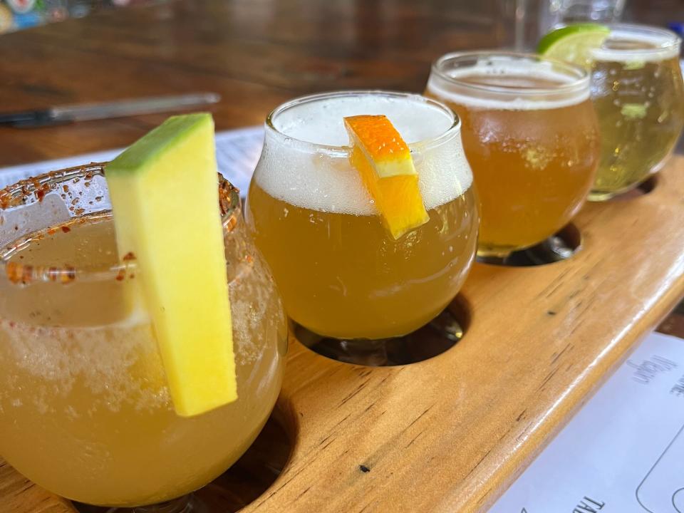 flight of beers on a bar at a brewery in hondoras