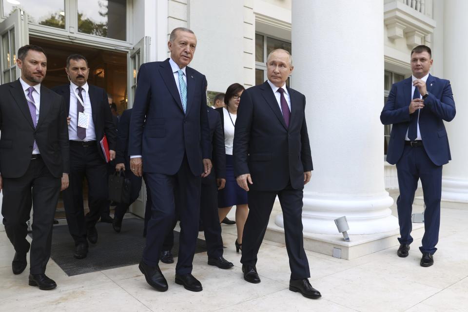 Russian President Vladimir Putin, center right, and Turkish President Recep Tayyip Erdogan, center left, walk after their talks at Russia's Black Sea resort of Sochi, Russia, Monday, Sept. 4, 2023. (Sergei Karpukhin, Sputnik, Kremlin Pool Photo via AP)