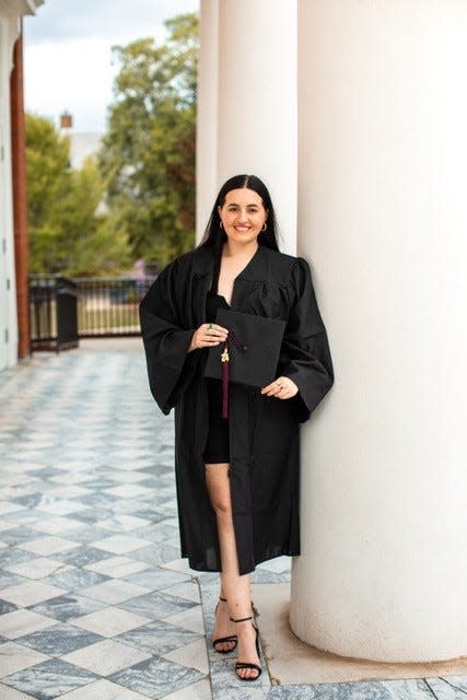 Hannah Mains in her graduation gown at Auburn University