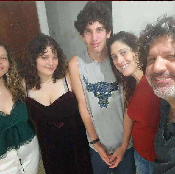 Debbie and Shlomi Mathias, at right, with their son, Rotem, and daughters, Shir and Shakked. All three of their children survived the Hamas massacre.