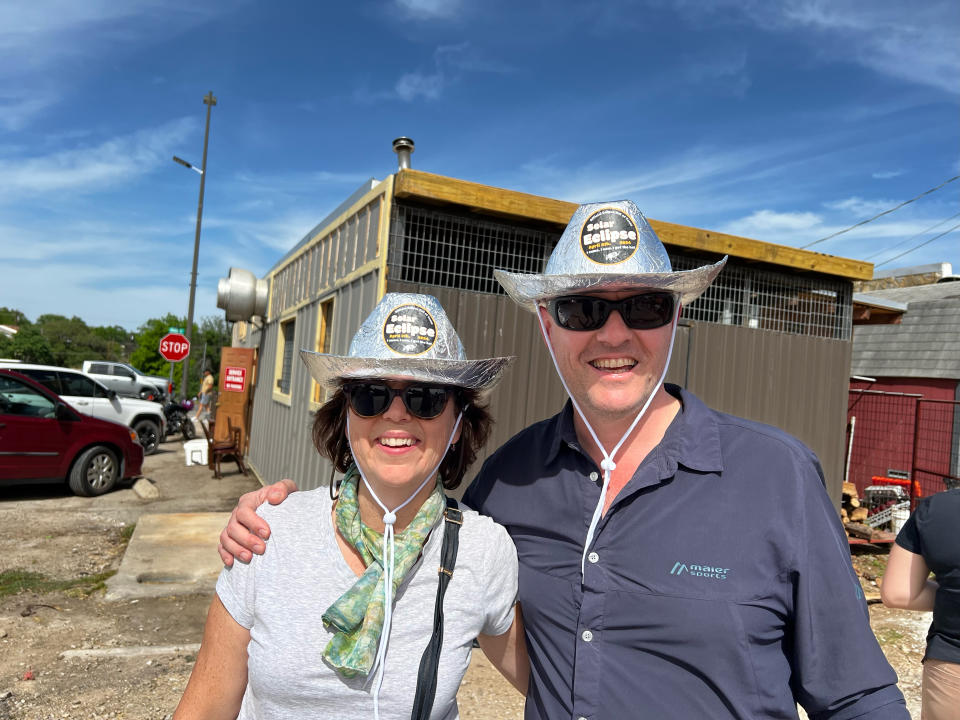 Lisa Spaulding and Jamie Carter show off the inevitable Texas eclipse souvenir.