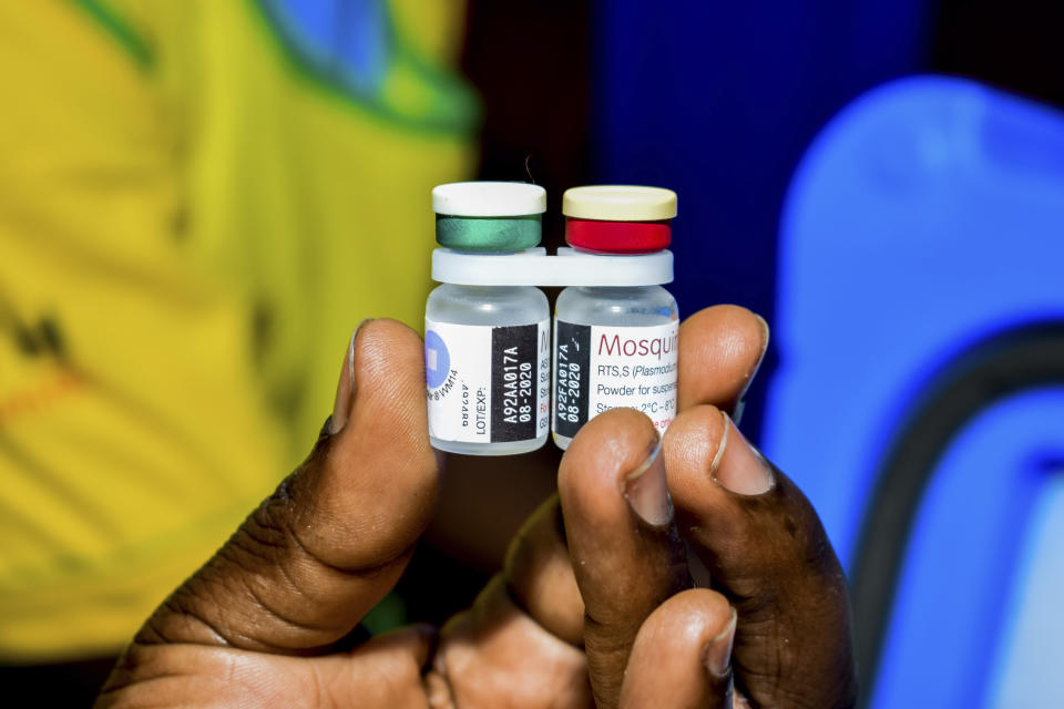 A health worker displays the new malaria vaccine in Homabay County, western Kenya, Friday, Sept. 13, 2019 The vaccine is the world's first for malaria and has been rolled out in Kenya, Ghana, and Malawi by the World Health Organisation (AP Photo/Joseph Oduor)