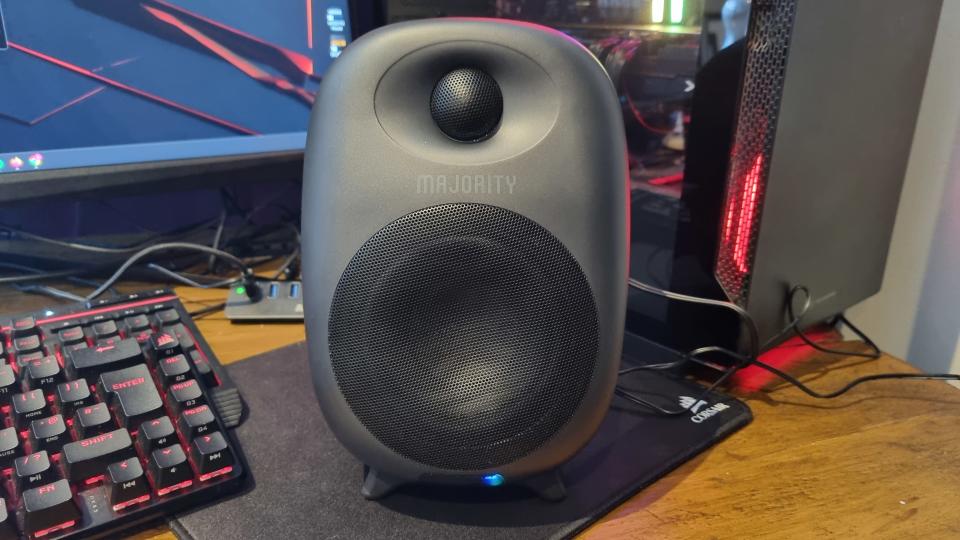 The right Majority D80 speaker, with a gaming PC and screen behind