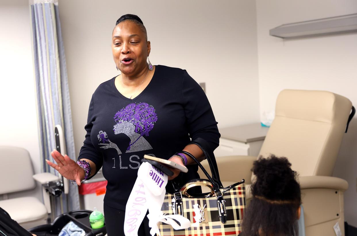 Maudie Simpson talks with the ONE Lupus Support Group Butterfly Pageant participants as they tour Oklahoma Medical Research Foundation in Oklahoma City.