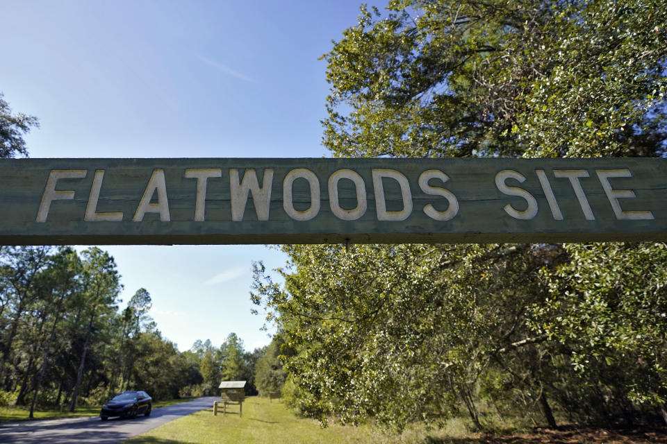 A sign is displayed at the entrance to the Flatwoods Conservation Park on Friday, Oct. 22, 2021, outside Tampa, Fla. The census lists no people living in the Flatwoods Conservation Park outside Tampa, even though it says there is a home occupied by people. According to Hillsborough County spokesman Todd Pratt, two county employees live there while maintaining security for the park. (AP Photo/Chris O'Meara)