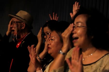 People shout slogans after the a news conference held by protesters in Hong Kong