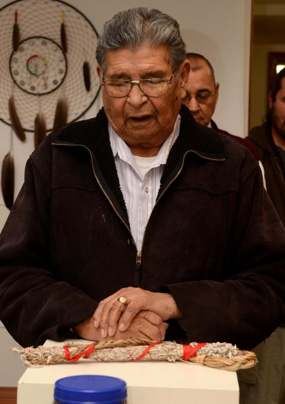 In this Saturday, Nov. 3, 2012 photo, Henry Anderson delivers a prayer during the grand opening of the Little Shell Chippewa Cree visitor center in Great Falls, Mont. (AP Photo/The Great Falls Tribune, Rion Sanders)
