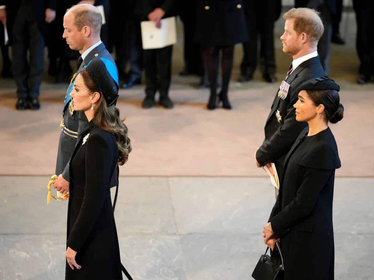 Photos show Prince William, Kate Middleton, Prince Harry, and Meghan Markle stan..