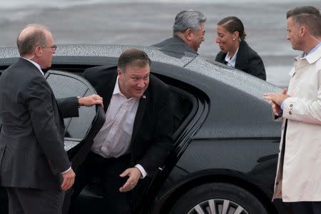 Secretary of State Mike Pompeo, second from left, accompanied by Andrew Kim, the head of the CIAÕs Korea Mission Center, third from right, arrives to board his plane at Yokota Air Force Base, in Fussa, Japan, Friday, July 6, 2018, to travel to Pyongyang, North Korea. Pompeo begins a trip traveling to North Korea, Japan, Vietnam, Abu Dhabi, and Brussels. (AP Photo/Andrew Harnik)