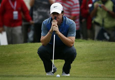 Northern Ireland's Rory McIlroy leans on his putter on the eighth hole during the second round of the Australian Open golf tournament at Royal Sydney Golf Club November 29, 2013. REUTERS/David Gray