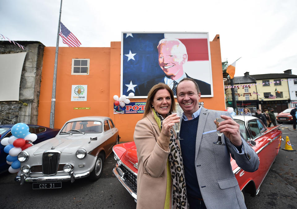 Image: Joe Blewitt and his wife Deirdre drink champagne underneath a mural of their third cousin Joe Biden as locals celebrate in anticipation of Joe Biden being elected as the next U.S. President (Charles McQuillan / Getty Images file)