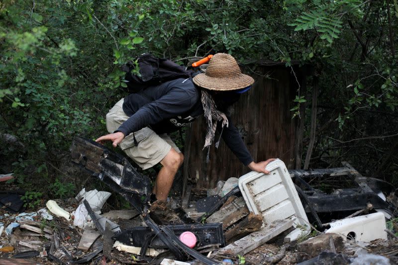 A volunteer anthropologist takes part in a search for skeletal remains and clothing at a plot of land in the municipality of Hidalgo