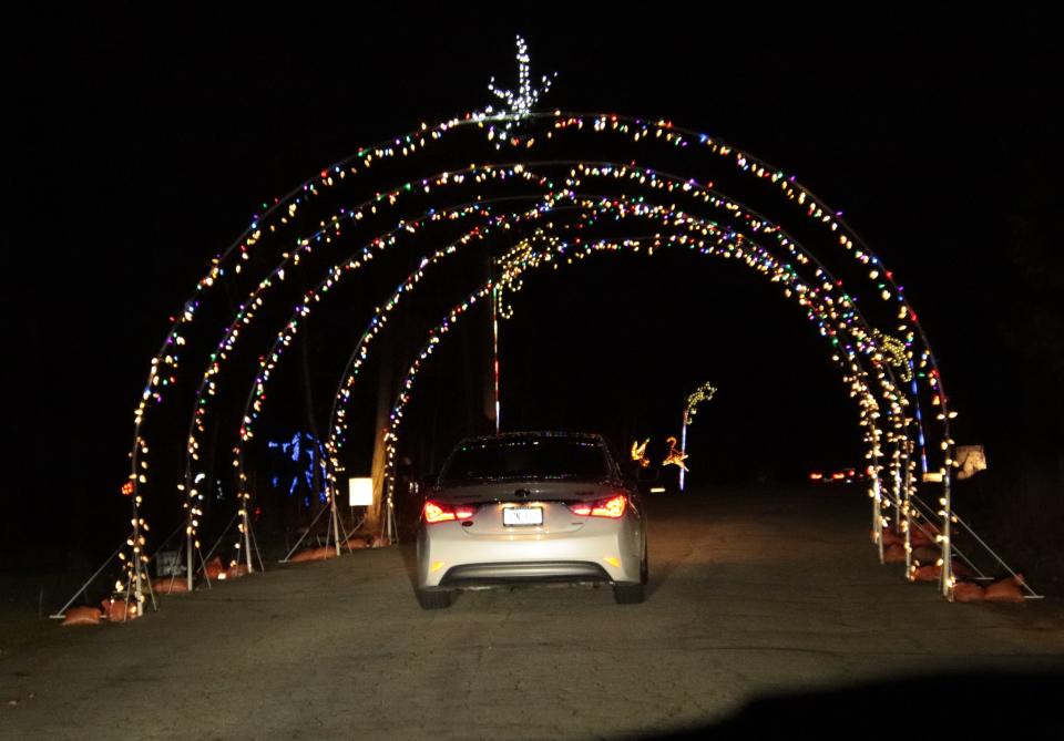 People drive through the Lights in Lincoln Park display at Manitowoc's Lincoln Park Zoo in 2020.