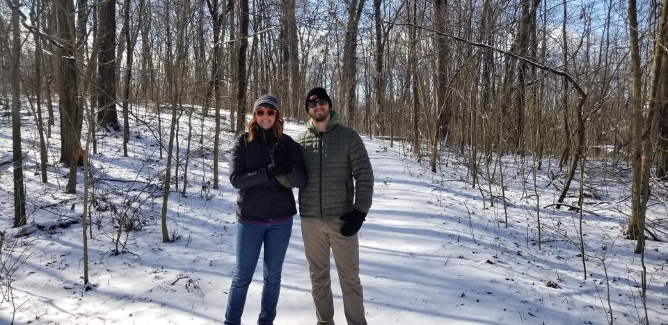 A couple enjoys a snowy walk through Red-tail’s preserve, Munsee Woods.