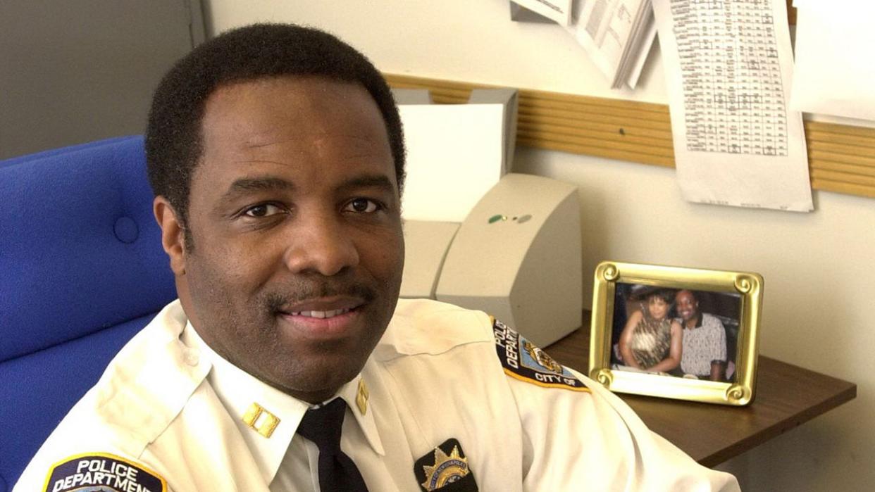 Timothy Pearson young and in uniform sitting at a desk