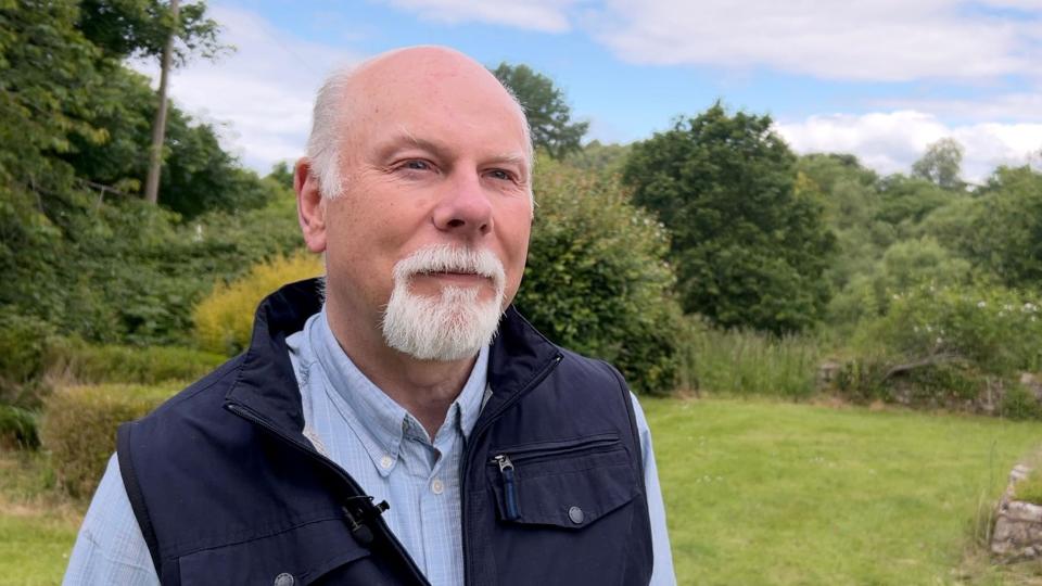 Martin Roberts standing in field 