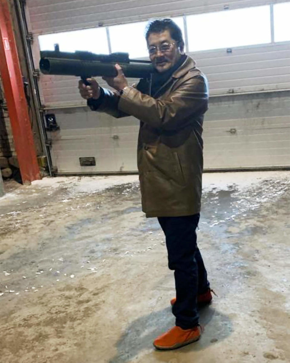 Takeshi Ebisawa poses with a rocket launcher during a meeting with an informant at a warehouse in Copenhagen (U.S. Magistrate Judge / SDNY / via Reuters file)
