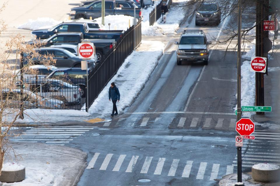 Snow and ice remains on parts of the sidewalk at Union Ave. and Walnut St. in Downtown Knoxville on Monday, January 22, 2024 in Knoxville, Tenn.