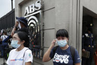 Supporters react after hearing the results of the voting at the House of Representative for the franchise renewal of ABS-CBN at the company headquarters of ABS-CBN in Quezon City, Philippines, Friday, July 10, 2020. Philippine lawmakers voted Friday to reject the license renewal of the country's largest TV network, shutting down a major news provider that had been repeatedly threatened by the president over its critical coverage. (AP Photo/Aaron Favila)