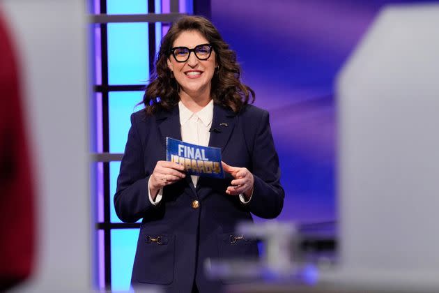 Host Mayim Bialik holds a 