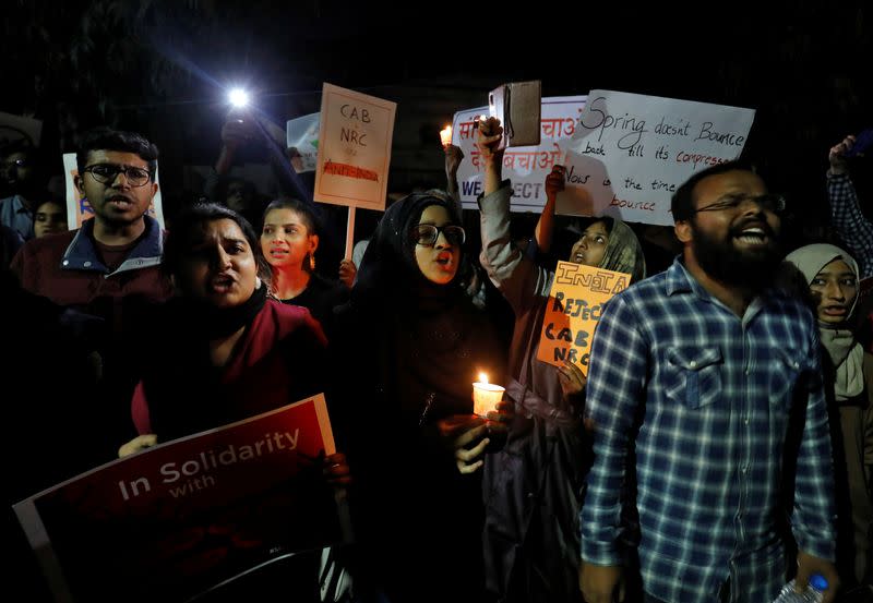 Demonstrators shout slogans during a protest against a new citizenship law and to show solidarity with the students of New Delhi's Jamia Millia Islamia university, in Ahmedabad