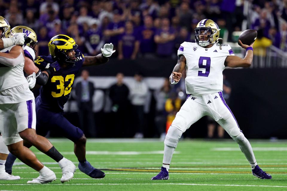 Jan 8, 2024; Houston, TX, USA; Washington Huskies quarterback Michael Penix Jr. (9) throws a pass against Michigan Wolverines linebacker Jaylen Harrell (32) during the fourth quarter in the 2024 College Football Playoff national championship game at NRG Stadium. Mandatory Credit: Troy Taormina-USA TODAY Sports