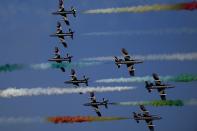 Frecce Tricolori (Tricolor Arrows), the Italian Air Force aerobatic display team, perform during the opening day of the Dubai Air Show, United Arab Emirates, Monday, Nov. 13, 2023. (AP Photo/Kamran Jebreili)