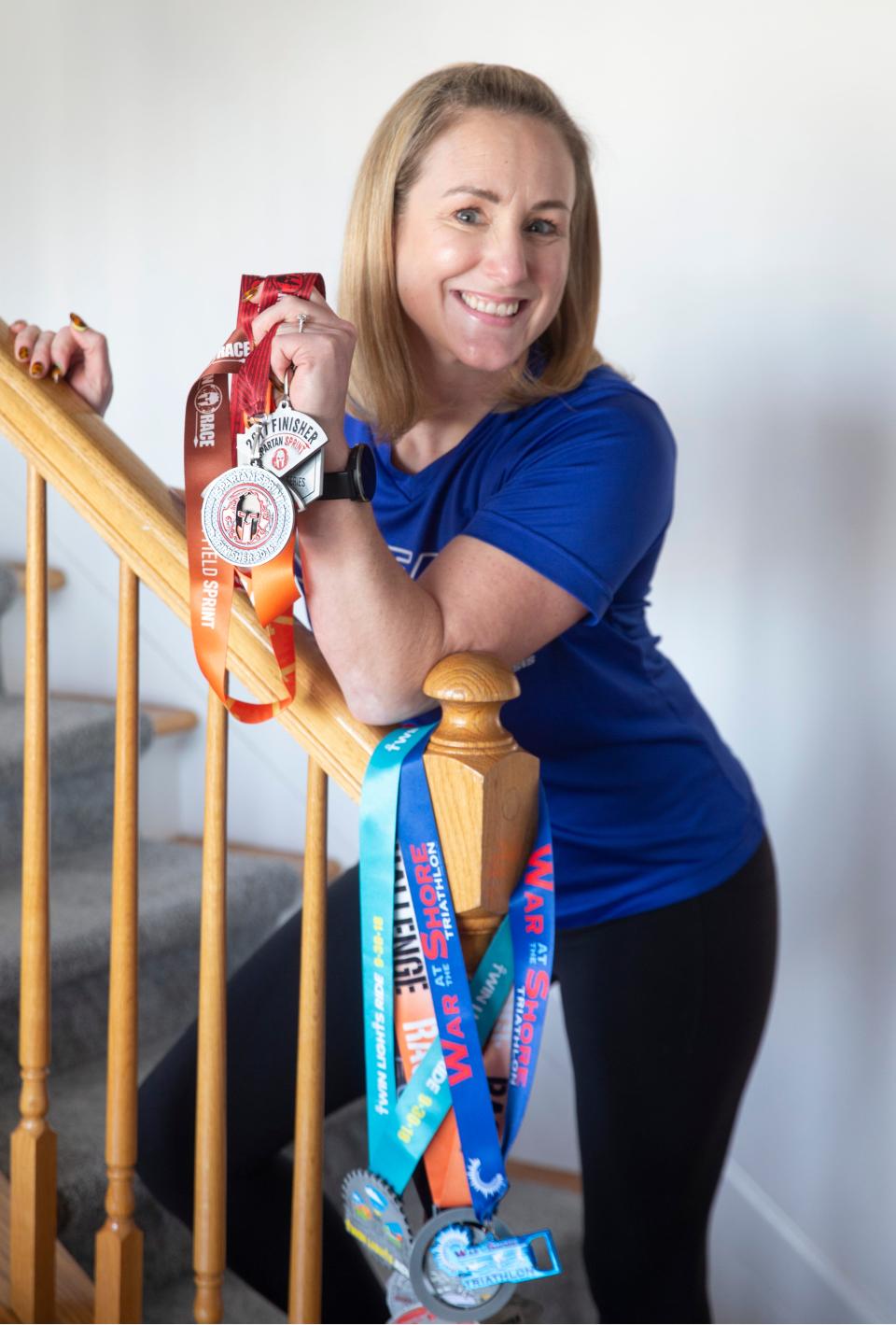 Laura Cariello shows off medals she has earned while battling multiple sclerosis and becoming a triathlete. She competes in various challenges throughout the area.  
Toms River, NJ
Friday, March 8, 2024