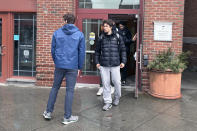 Dartmouth basketball players, including Cade Haskins, left, and Romeo Myrthil leave after voting in Hanover, N.H., Tuesday, March 5, 2024. The Dartmouth men's basketball team has voted to unionize, taking an unprecedented step toward forming the first-ever labor union for college athletes. (AP Photo/Jimmy Golen)